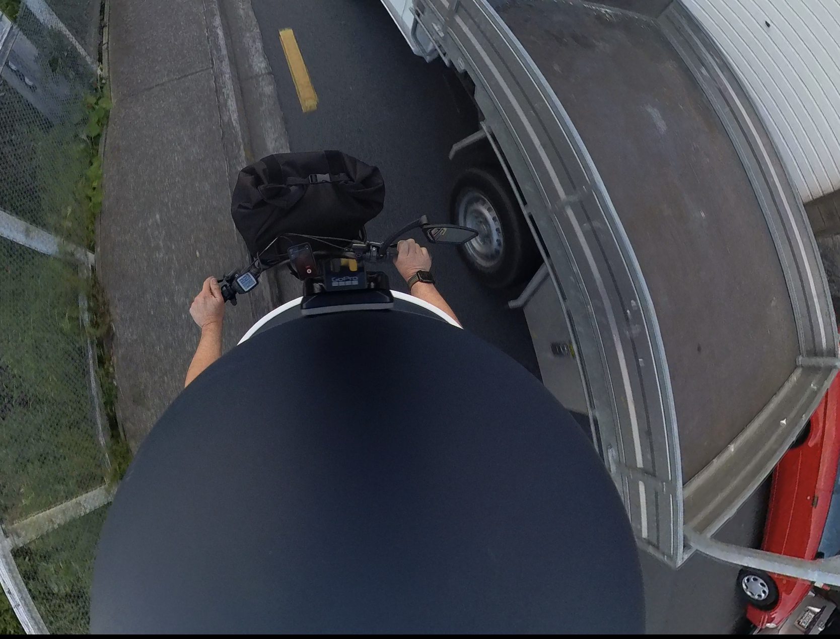 Look at this luncacy. All because he was frustrated having to wait seconds. A photo from my helmet camera showing a ute tray passing me within millimetres. 